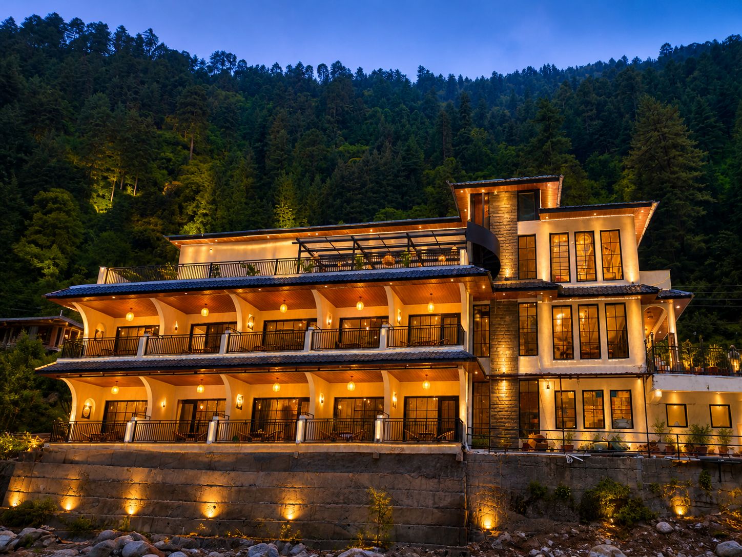 Tiraya lit up at night in Tirthan Valley